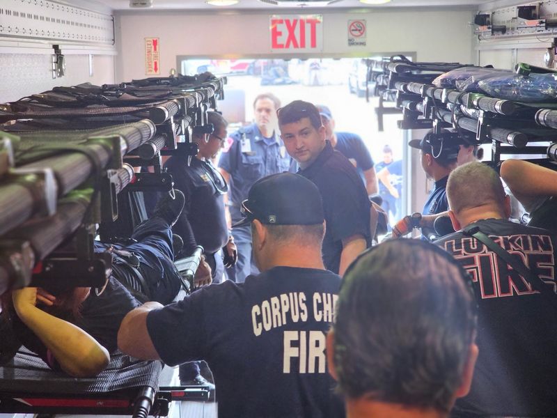 Corpus Christi Fire Department first responders are seen aboard an AMBUS emergency vehicle after deploying to Kerr County to help with the flood relief effort.