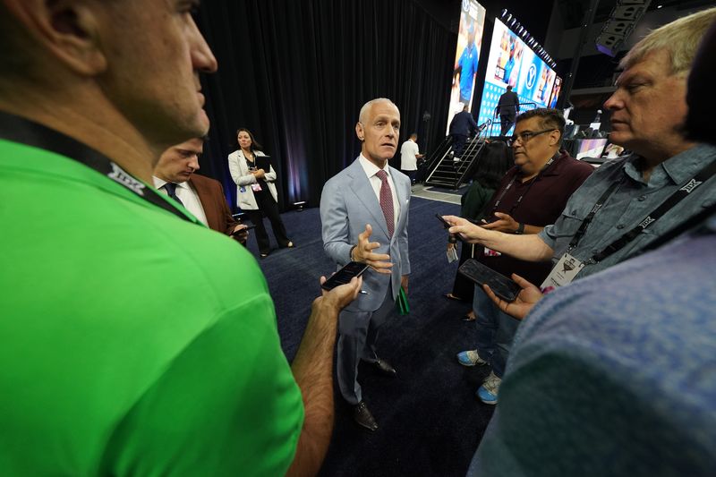 Jul 8, 2025; Frisco, TX, USA; Big 12 Commissioner Brett Yormark talks with media members during the 2025 Big 12 Football Media Days at The Star. Mandatory Credit: Raymond Carlin III-Imagn Images