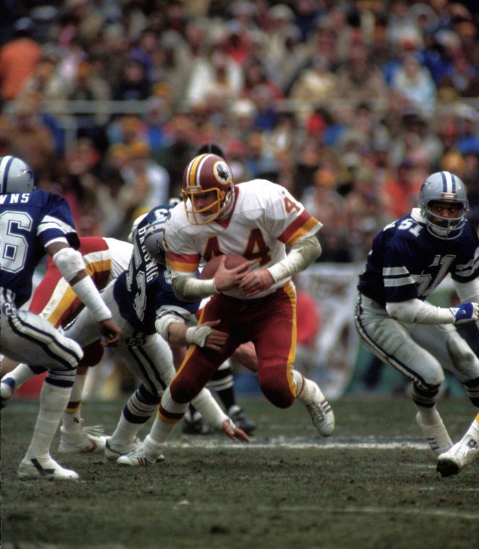 Jan 22, 1983; Washington, DC, USA; FILE PHOTO; Washington Redskins running back John Riggins carries the ball against the Dallas Cowboys in the 1983 NFC Championship game at RFK Stadium. Washington defeated Dallas 31-17. Mandatory Credit: Photo By Manny Rubio-USA TODAY Sports
