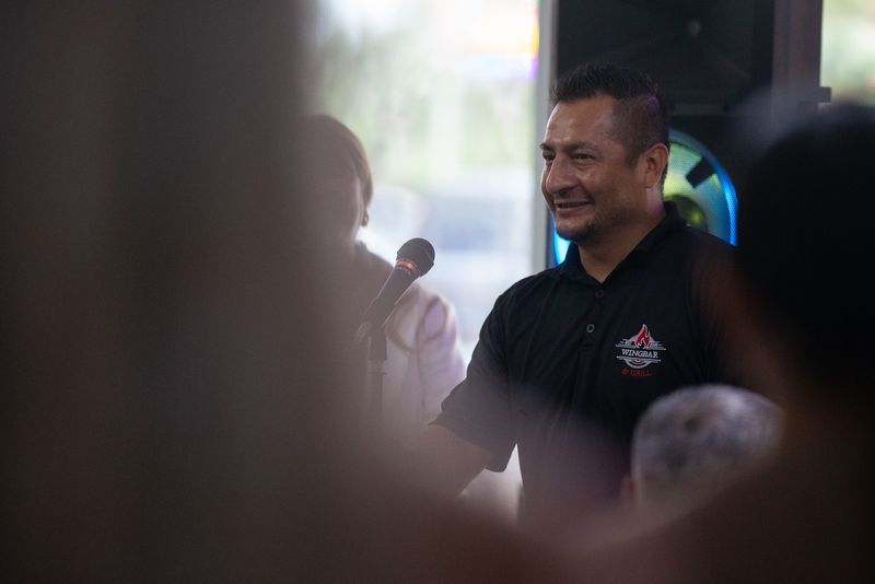 Wingbar & Grill co-owner Ivan Garcia speaks to a crowd of people at the new restaurant in Corpus Christi on July 9.