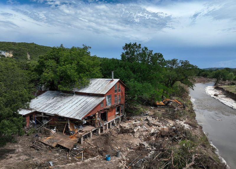 A house on Sandy Meadow Circle on the banks of Big Sandy Creek near Leander, Wednesday, July 9, 2025, was heavily damaged in the Fourth of July weekend flood