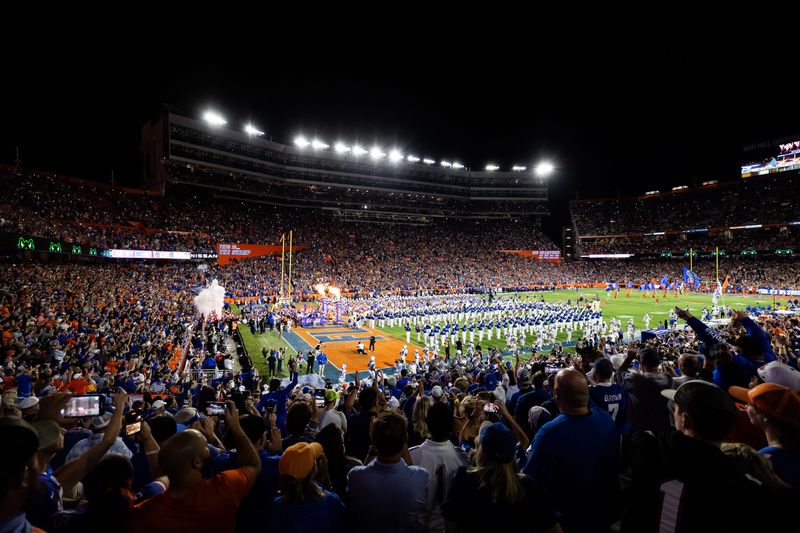 Oct 19, 2024; Gainesville, Florida, USA; Players run onto the field before a game between the Florida Gators and Kentucky Wildcats at Ben Hill Griffin Stadium. Mandatory Credit: Matt Pendleton-Imagn Images