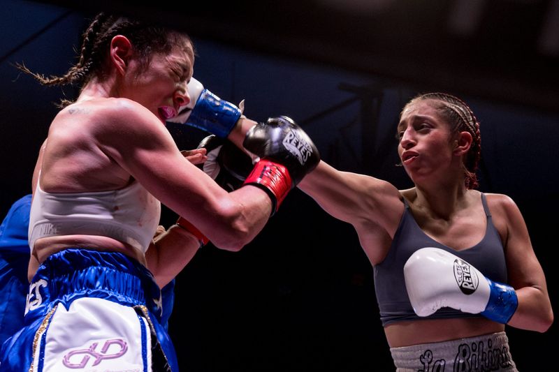 El Paso flyweight Nayeli Rodriguez lands a punch on Alexis Mones of Fort Worth during the Kings Promotions Ring Wars boxing match at the El Paso County Coliseum on Saturday, July 12, 2025.