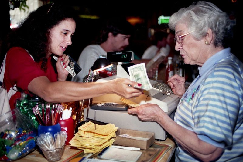 Evelyn Rotier, right, takes a diner money after she enjoyed her lunch at Rotier’s restaurant, 2413 Elliston Place in Nashville on July 20, 1995. Mrs. Rotier, who has worked the cash register for nearly 50 years, run the restaurant with her children, Charlie, John and Margaret Anne Crouse.