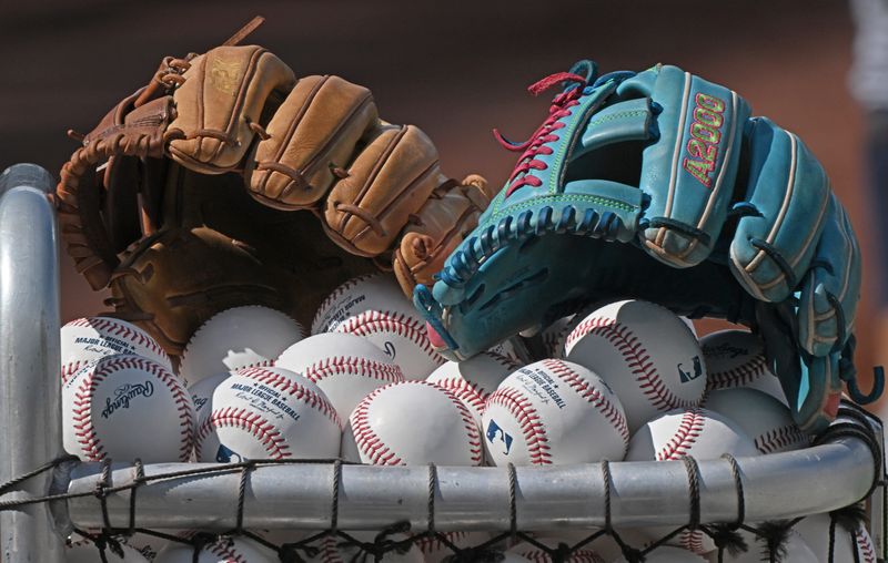 Jun 24, 2025; Kansas City, Missouri, USA; A general view off baseball gloves and baseballs before a game between the Tampa Bay Rays and Kansas City Royals at Kauffman Stadium. Mandatory Credit: Peter Aiken-Imagn Images