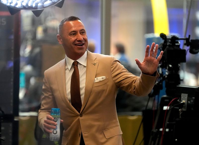 July 15, 2025; Atlanta, GA, USA; Texas head coach Steve Sarkisian waves to fans during SEC Media Days at the College Football Hall of Fame in Atlanta.