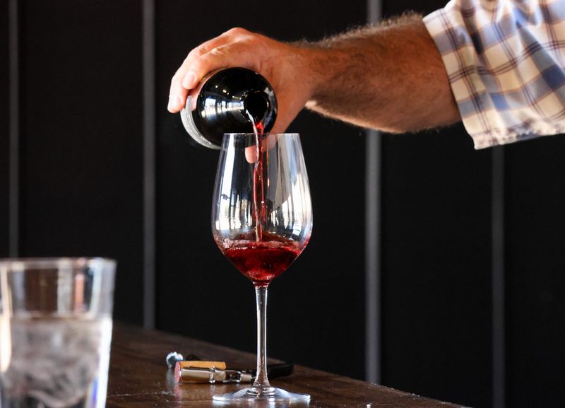 Jason Veesart, co-owner of The Crush Pad by Veesart Cellars, pours a glass of Veesart Vineyards' red wine at the wine bar's recently opened location at 1717 Crickets Ave., on July 10, 2025 in Lubbock, Texas.