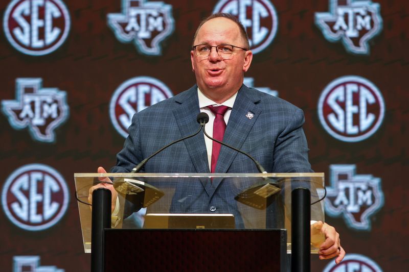 Jul 17, 2025; Atlanta, GA, USA; Texas A&M Aggies head coach Mike Elko talks to the media during the SEC Media Days at Omni Atlanta Hotel. Mandatory Credit: Jordan Godfree-Imagn Images
