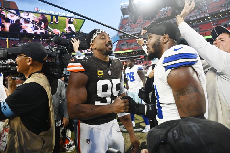 Sep 8, 2024; Cleveland, Ohio, USA; Cleveland Browns defensive end Myles Garrett (95) talks to Dallas Cowboys linebacker Micah Parsons (11) after the game at Huntington Bank Field. Mandatory Credit: Ken Blaze-Imagn Images