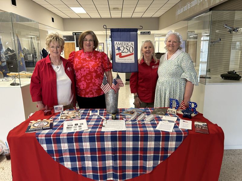 Members of the Molly Goodnight Chapter of the Daughters of the American Revolution get ready for the Patriotic Car Show, to be held Saturday, July 26. Members, from left, are Cheryl Thurman, second vice regent of DAR and chairman of the car show; Mellessa Denny, first vice regent; Jenny Blessen, historian of the chapter; and Tina Lusby, chairman of public relations for the group.