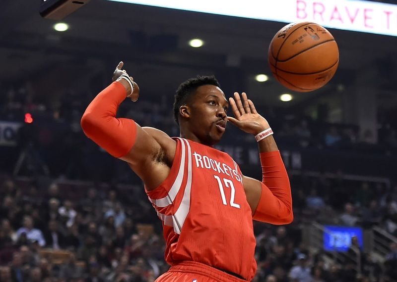 Mar 6, 2016; Toronto, Ontario, CAN; Houston Rockets center Dwight Howard (12) reacts after a dunk against Toronto Raptors in the first half at Air Canada Centre. Mandatory Credit: Dan Hamilton-USA TODAY Sports