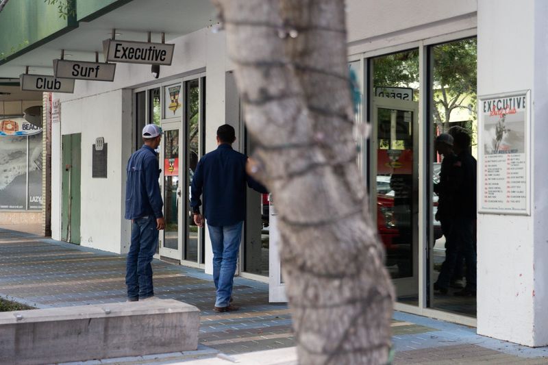 People enter Executive Surf Club in Corpus Christi on July 22.