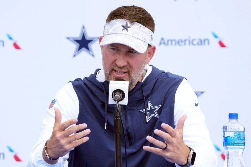 Jul 22, 2025; Oxnard, CA, USA; Dallas Cowboys coach Brian Schottenheimer during training camp press conference at the River Ridge Fields. Mandatory Credit: Kirby Lee-Imagn Images