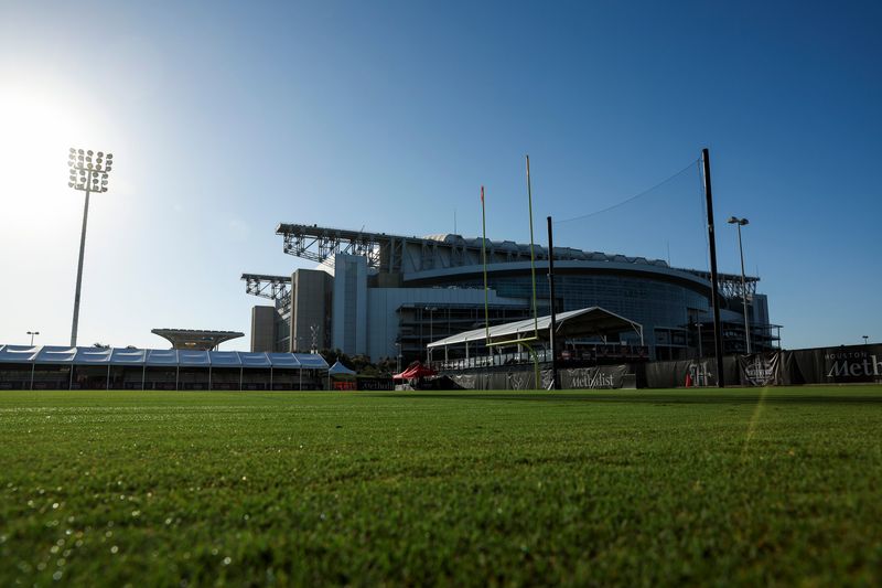 Jul 23, 2025; Houston, TX, USA; View of the field before training camp at Houston Methodist Training Center with NRG stadium in the background. Mandatory Credit: Troy Taormina-Imagn Images