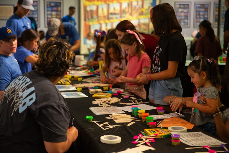 Children attempt to build bridges with craft supplies at Valero's STEM Day by the Bay at the Corpus Christi Museum of Science and History in Corpus Christi, Texas, on July 26, 2025.