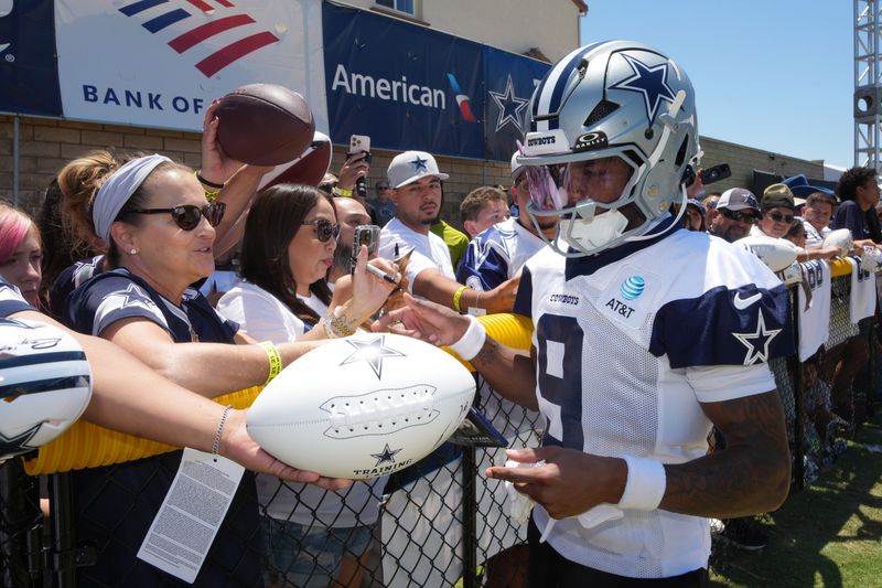 Jul 26, 2025; Oxnard, CA, USA; Dallas Cowboys receiver Kavontae Turpin (9) signs autographs at training camp at the River Ridge Fields. Mandatory Credit: Kirby Lee-Imagn Images