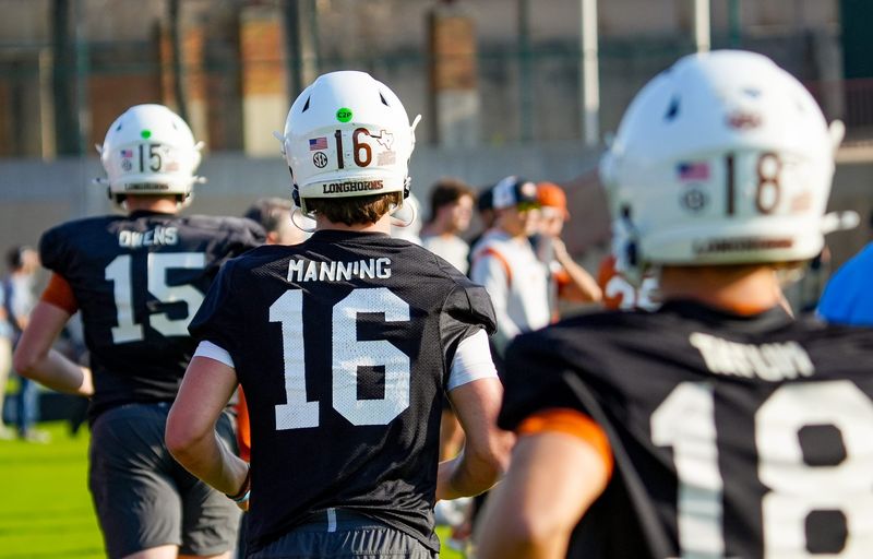 Texas Longhorns quarterbacks take the field during their first practice of the spring season on Tuesday, March 25, 2025.