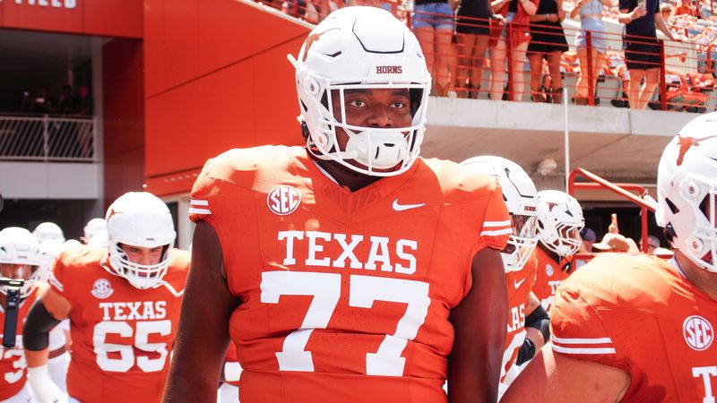 Aug 31, 2024; Austin, Texas, USA; Texas Longhorns lineman Andre Cojoe (77) runs out onto the field before a game at Darrell K Royal-Texas Memorial Stadium. Mandatory Credit: Aaron Meullion-USA TODAY Sports