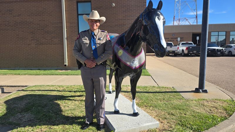 DPS Northwest Texas Region Chief Joe Longway stands beside “Trooper,” a life-size fiberglass American Quarter Horse statue unveiled outside the Amarillo District Office on July 29, 2025. The statue is part of the Hoof Prints of the American Quarter Horse public art project.