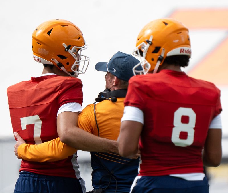 UTEP Miners football quarter back Malachi Nelson (7) and Shay Smith (8) return to head coach Scotty Walden at practice at the Sunbowl Stadium in El Paso, Texas on August 1, 2025.