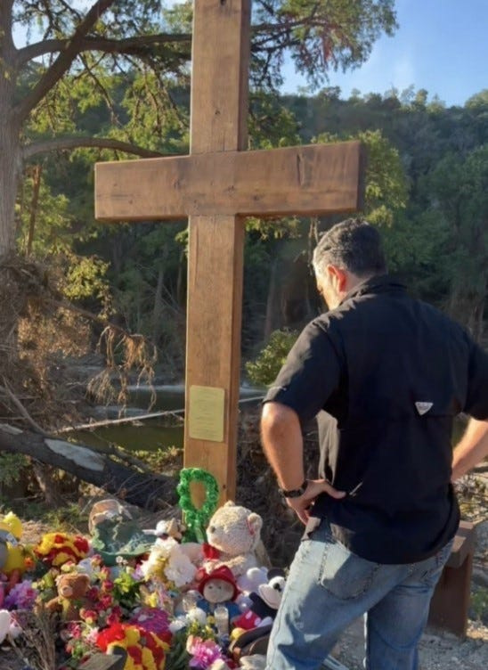 State Sen. Cesar Blanco, D-El Paso, visits a memorial at Camp Mystic in Kerr County, Texas. Flooding in the area resulted in the deaths of 27 campers and counselors at the all-girl Christian camp in July 2025.