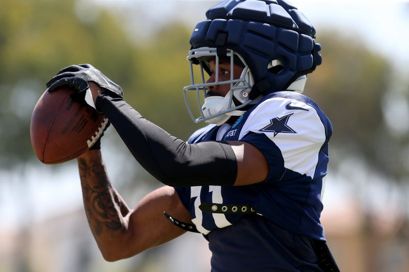 Jul 30, 2024; Oxnard, CA, USA; Dallas Cowboys cornerback Josh Butler (31) makes a catch during training camp at the River Ridge Playing Fields in Oxnard, California. Mandatory Credit: Jason Parkhurst-USA TODAY Sports