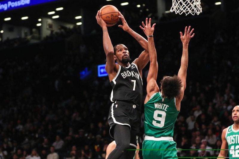 Dec 4, 2022; Brooklyn, New York, USA; Brooklyn Nets forward Kevin Durant (7) looks to drive past Boston Celtics guard Derrick White (9) in the third quarter at Barclays Center. Mandatory Credit: Wendell Cruz-USA TODAY Sports