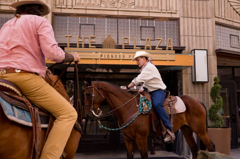Pat Gordon, a member of the El Paso County Sheriff's Posse, rides his horse in front of the Plaza hotel during the city of El Paso's Saddle Day in El Paso, Texas, on Saturday, Aug. 9, 2025.