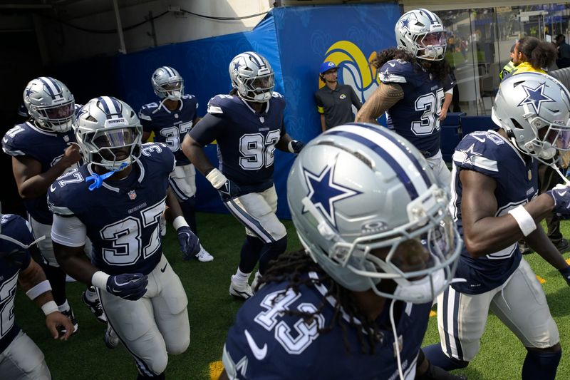 Aug 9, 2025; Inglewood, California, USA; Dallas Cowboys run on to the field for the first half against the Los Angeles Rams at SoFi Stadium. Mandatory Credit: Jayne Kamin-Oncea-Imagn Images