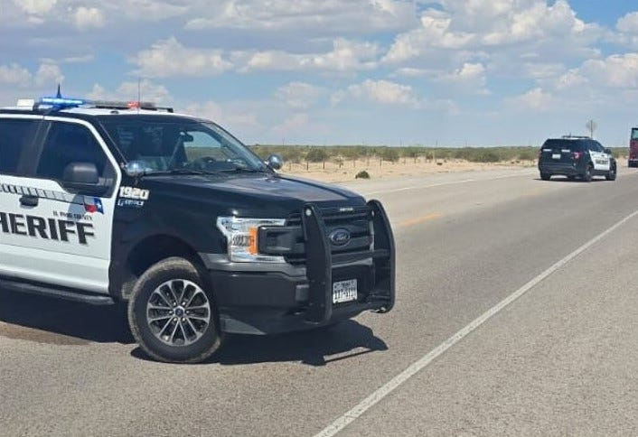 The El Paso County Sheriff's Office blocks a roadway following a head-on collision that killed two women near the intersection of M.F. Aguilera Road and O.T. Smith Road near Tornillo, Texas, on Aug. 9, 2025.