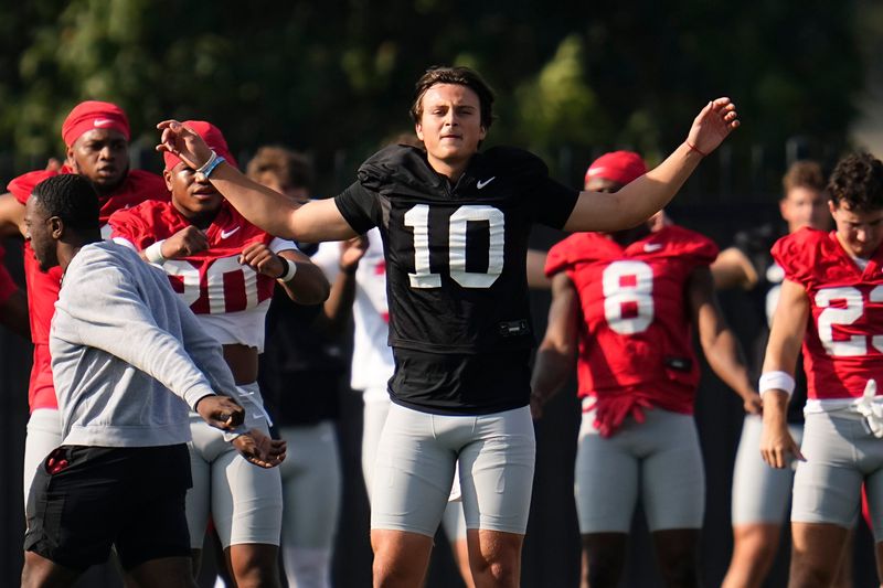 Ohio State Buckeyes quarterback Julian Sayin (10) stretches during football training camp at the Woody Hayes Athletic Center on Aug. 2025.
