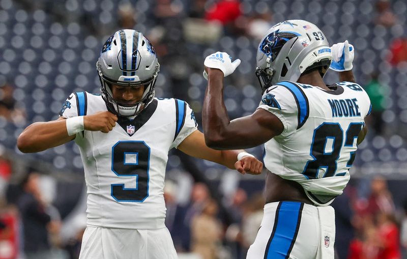 Aug 16, 2025; Houston, Texas, USA; Carolina Panthers quarterback Bryce Young (9) and wide receiver David Moore (83) perform a celebration dance before playing against the Houston Texans at NRG Stadium. Mandatory Credit: Thomas Shea-Imagn Images