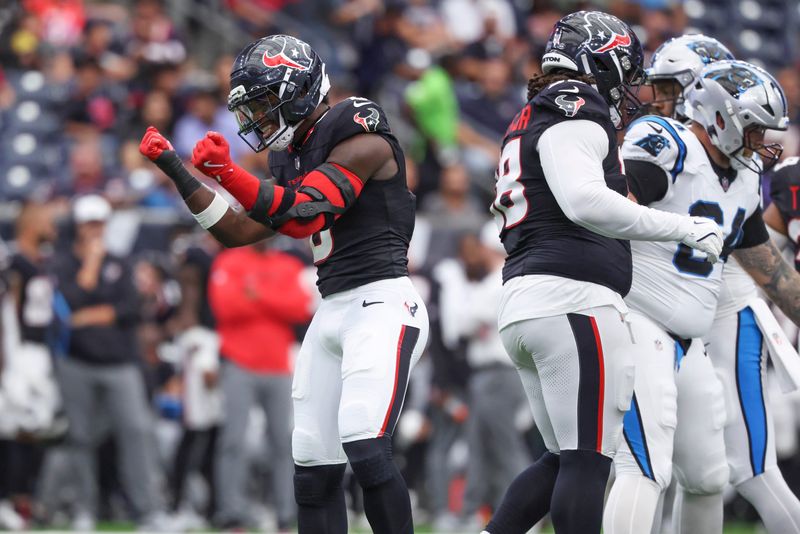 Aug 16, 2025; Houston, Texas, USA; Houston Texans linebacker Azeez Al-Shaair (0) reacts after a defensive play during the first quarter against the Carolina Panthers at NRG Stadium. Mandatory Credit: Troy Taormina-Imagn Images