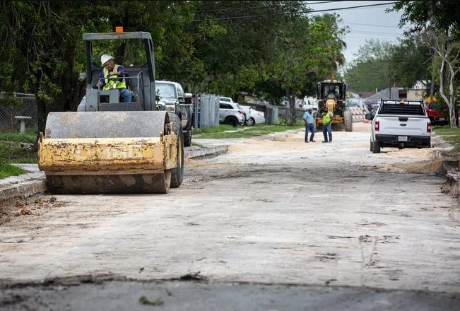 In this April 2023 file photo, construction workers prepare to pave a strip of Prescott Street near Gollihar Road.