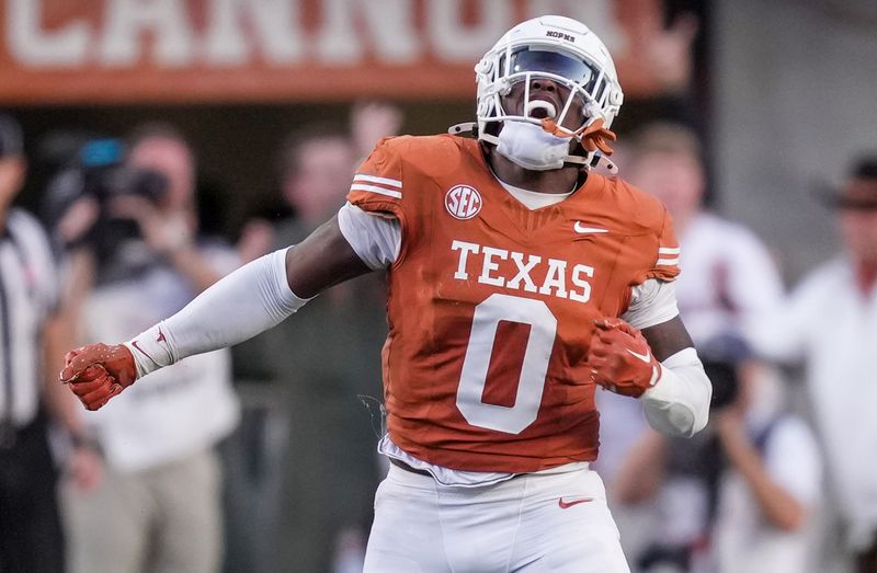 Nov 23, 2024; Austin, Texas, USA; Texas Longhorns linebacker Anthony Hill Jr. (0) celebrates after a stop against the Kentucky Wildcats on fourth down in the third quarter at Darrell K Royal Texas Memorial Stadium. Mandatory Credit: Ricardo B. Brazziell/USA TODAY Network via Imagn Images