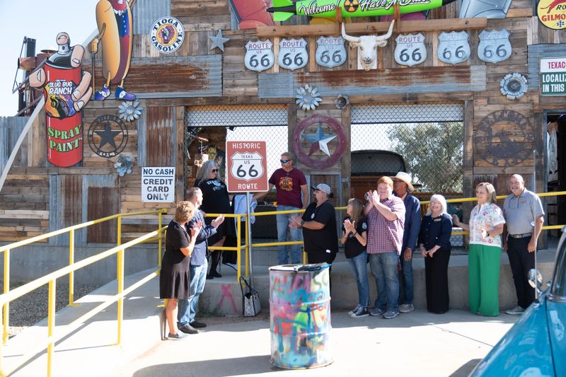 Supporters unveil one of the new historic Route 66 signs during a press event Aug. 21 outside the Starlight Ranch in Amarillo. The Texas Route 66 Signage Project, funded in part by the Big Texan Steak Ranch, will restore signage across the Panhandle ahead of the highway’s 2026 centennial.