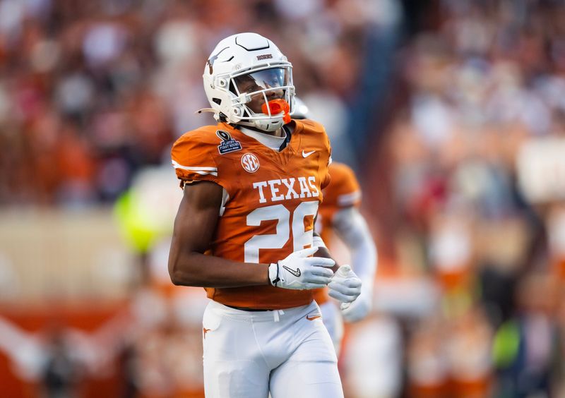 Dec 21, 2024; Austin, Texas, USA; Texas Longhorns linebacker Ty'Anthony Smith (26) against the Clemson Tigers during the CFP National playoff first round at Darrell K Royal-Texas Memorial Stadium. Mandatory Credit: Mark J. Rebilas-Imagn Images