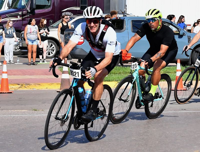 Russell Betts (9021) and Muniz Carlos (7123) round a curve at Hell's Gate in Burkburnett, during the 44th annual Hotter'N Hell Endurance Ride on Aug. 23, 2025.
