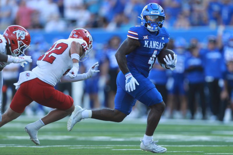 Kansas Jayhawks running back Leshon Williams (4) runs in for a touchdown during the game between Fresno State and Kansas at David Booth Kansas Memorial Stadium on Aug. 23, 2025.