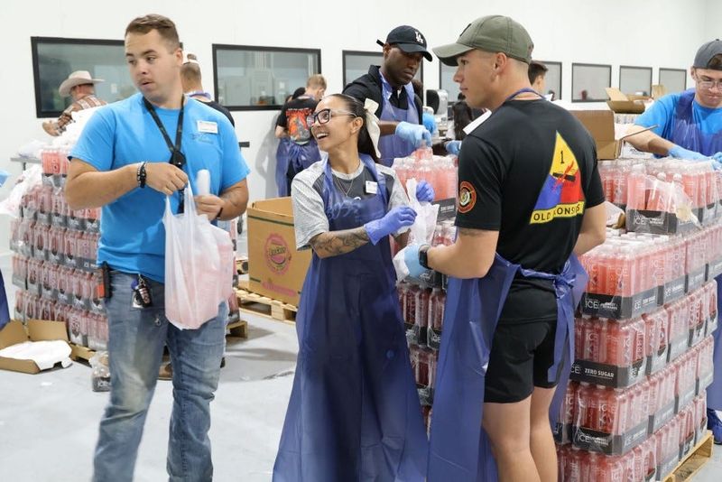 Sgt. Marasia Anne Olang (middle), the President of the Fort Bliss Better Opportunities for Single Soldiers (BOSS) Program, leads volunteer efforts from Fort Bliss soldiers during the "United in Service" event at the El Pasoans Fighting Hunger Food Bank Aug. 23, 2025. Over 200 soldiers volunteered their time at the El Pasoans Fighting Hunger Food Bank, packaging food items for distribution.