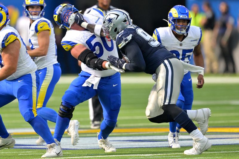 Aug 9, 2025; Inglewood, California, USA; Los Angeles Rams center Beaux Limmer (50) and Dallas Cowboys defensive tackle Perrion Winfrey (99) battle on the line during the first half at SoFi Stadium. Mandatory Credit: Jayne Kamin-Oncea-Imagn Images
