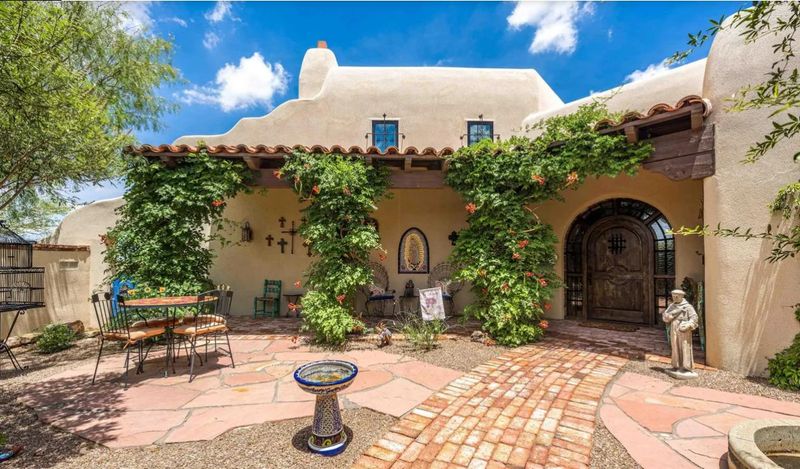The Santa Barbara-Mission style home, located at 5002 Heno Mine Road, is one-of-a-kind with custom-built cabinetry and ornate doors handcrafted by its current owner, who spent decades building custom homes in Colorado and New Mexico.