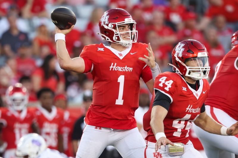 Aug 28, 2025; Houston, Texas, USA; Houston Cougars quarterback Conner Weigman (1) attempts a pass during the first quarter against the Stephen F. Austin Lumberjacks at TDECU Stadium. Mandatory Credit: Troy Taormina-Imagn Images