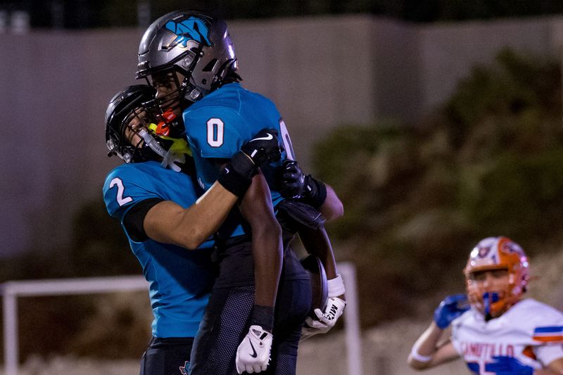 Pebble Hills’ Noah Tarrant (2) celebrates Lj Bailey’s (0) touchdown after a lightning delay during the Spartans’ season opener against Canutillo on Friday, Aug. 29, 2025, at the SAC in El Paso, Texas.