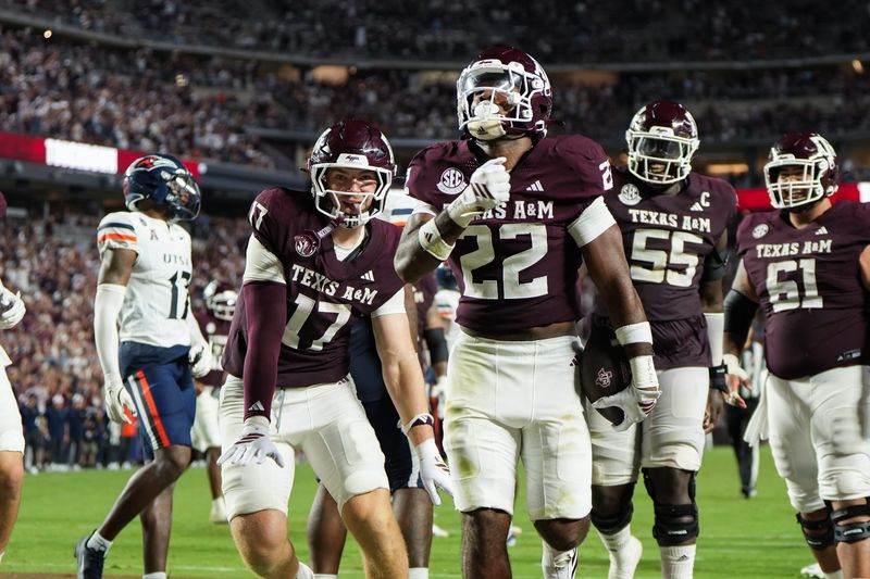 Aug 30, 2025; College Station, Texas, USA; Texas A&M Aggies tight end Theo Melin Ohrstrom (17) and Texas A&M Aggies running back EJ Smith (22) celebrate a touchdown during the second half against the UTSA Roadrunners at Kyle Field. Mandatory Credit: Sean Thomas-Imagn Images