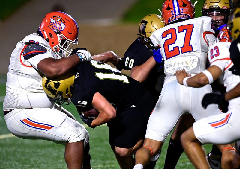Bobcats defensive lineman Brian Sandoval tackles Abilene High running back Josh Castillo during the Eagles’ game against San Angelo Central at Shotwell Stadium Friday Aug. 29, 2025. Final score was 42-21, Abilene High.