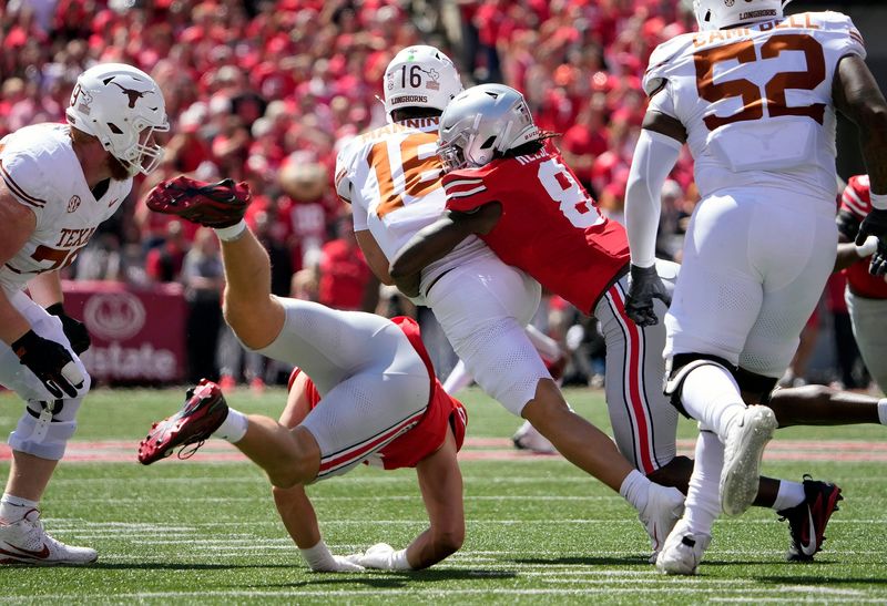Ohio State Buckeyes linebacker Arvell Reese (8) tackles Texas Longhorns quarterback Arch Manning (16) on a run in the first quarter of their game at Ohio Stadium in Columbus, Ohio on Aug 30, 2025.