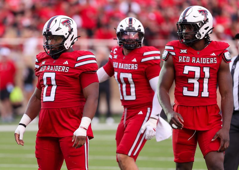 Texas Tech's Skyler Gill-Howard (0), David Bailey (31) and Jacob Rodriguez prepare to play defense against Arkansas-Pine Bluff during a non-conference football game, Saturday, August 30, 2025, at Jones AT&T Stadium.