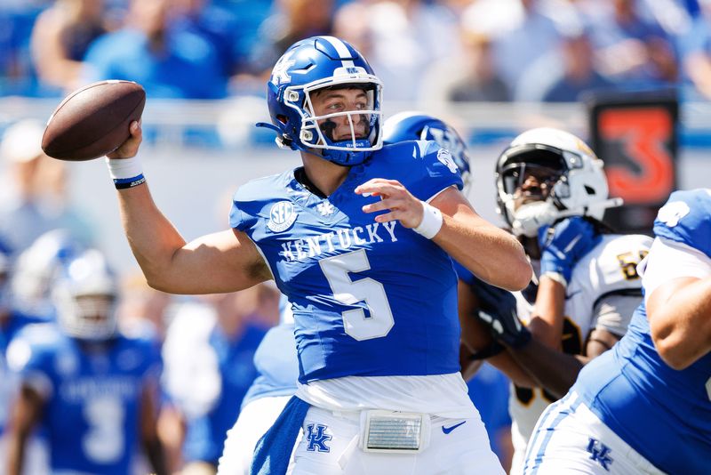 Aug 30, 2025; Lexington, Kentucky, USA; Kentucky Wildcats quarterback Zach Calzada (5) throws a pass during the first quarter against the Toledo Rockets at Kroger Field. Mandatory Credit: Jordan Prather-Imagn Images