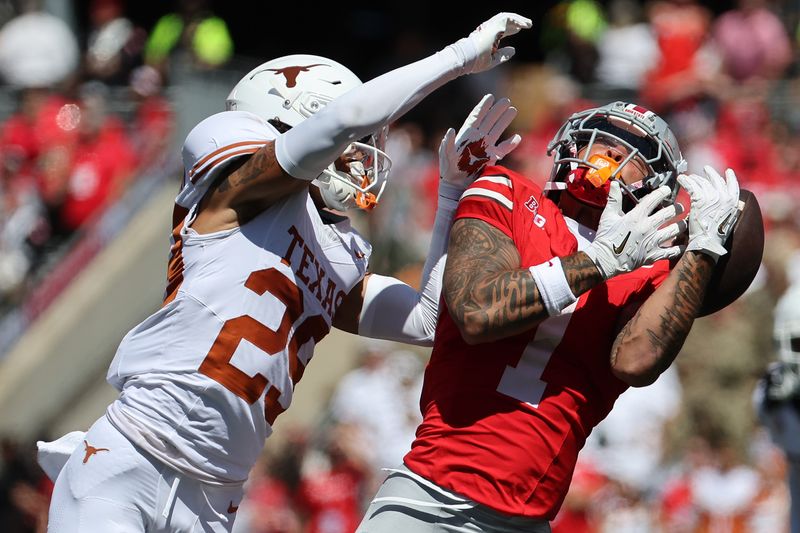 Aug 30, 2025; Columbus, Ohio, USA; Ohio State Buckeyes wide receiver Brandon Inniss (1) attempts to make a catch over Texas Longhorns defensive back Graceson Littleton (29) in the first half at Ohio Stadium. Mandatory Credit: Joseph Maiorana-Imagn Images